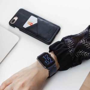 Cosmos-IPhone-8-plus-blue-leather-case-on-a-white-murmle-matches-a-blue-woman-outfit
