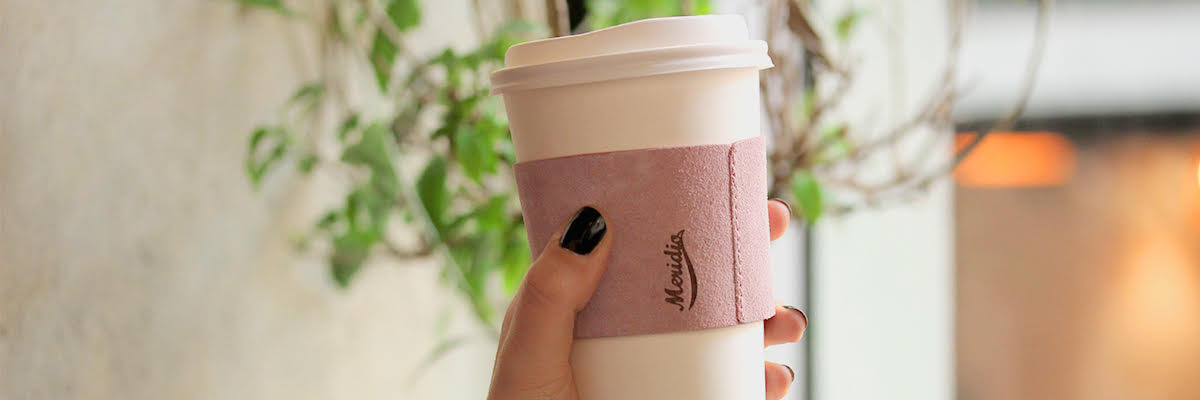 A leather coffee cup sleeve by Meridio