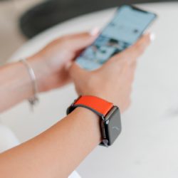 Lobster-Apple-watch-red-orange-rubber-band-close-to-iphone
