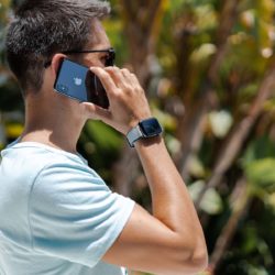 Summer-Cloud-Apple-watch-grey-rubber-band-keeping-a-black-iphone