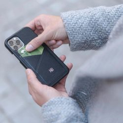 Carbon-Core_iphone-12-pro-leather-case-handling-with-a-grey-coat