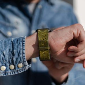 AW-bullet-proof-green-leather-band-with-focus-on-monogram