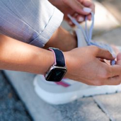 Blue-Abyss-Apple-watch-rubber-band-close-to-a-running-shoes