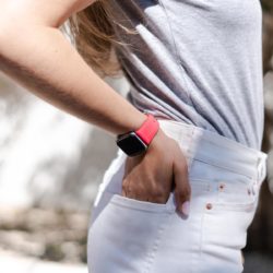 Iced Watermelon-Apple-watch-fuchsia-fluo-band-close-to-a-white-jeans-bs