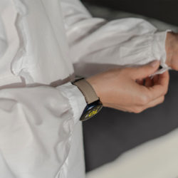 Galaxy-watch-active-grey-leather-band-with-a-focus-on-monogram-for-her-with-a-white-shirt