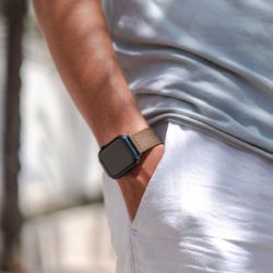 Apple-watch-bronze-tide-band-recycled-ocean-plastic-man-outfit-with-shirt-white-trousers
