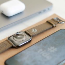 Apple-watch-bronze-tide-band-recycled-ocean-plastic-on-back-side-with-focus-on-logo