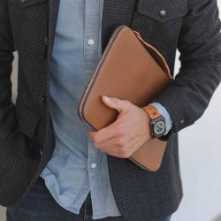 AW light brown full grain leather band for man handling a macbook sleeve