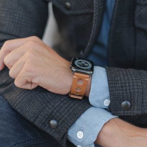 AW light brown full grain leather band for man wearing a jacket