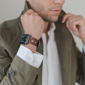 AW dark brown full grain leather band for man wearing a green coat
