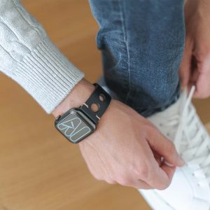 AW black full grain leather band for man handling his white shoes