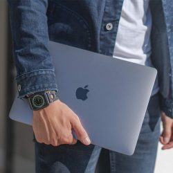 AW black full grain leather band for man keeping his macbook