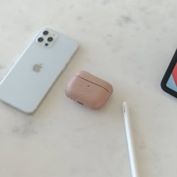 Blush-aripods-pro-leather-case-on-top-close-to-iphone12