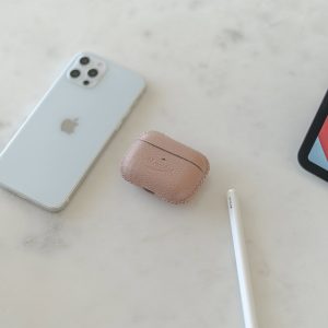 Blush-aripods-pro-leather-case-on-top-close-to-iphone12