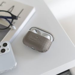 Airpods_pro_leather-case-on-top-a-desk-open